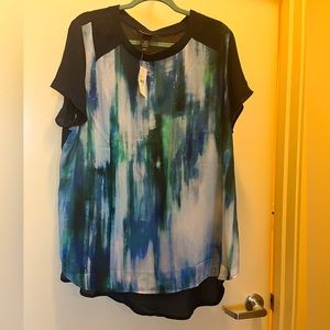 Lane Bryant with tags. Blue multi colored, short sleeved high low hemline.